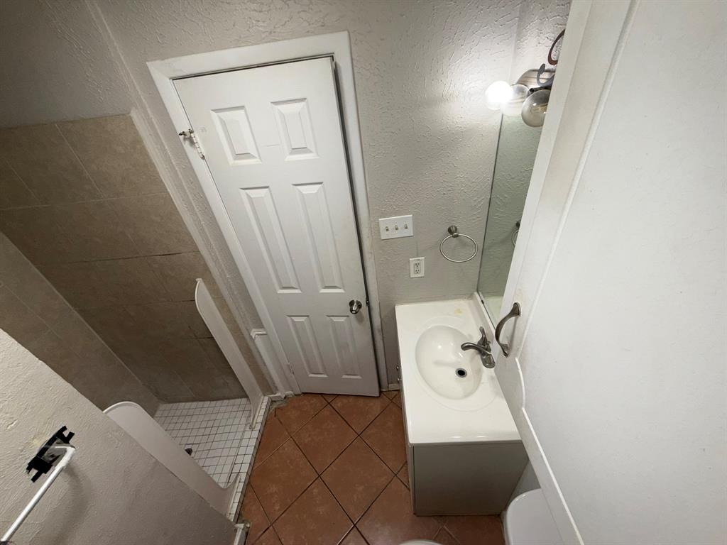 708 East Pecan Street Hurst, TX 76053 - Photo 8 of 10 wooden floor view with a sink