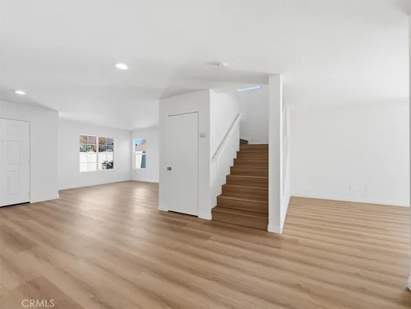 a view of entryway with wooden floor