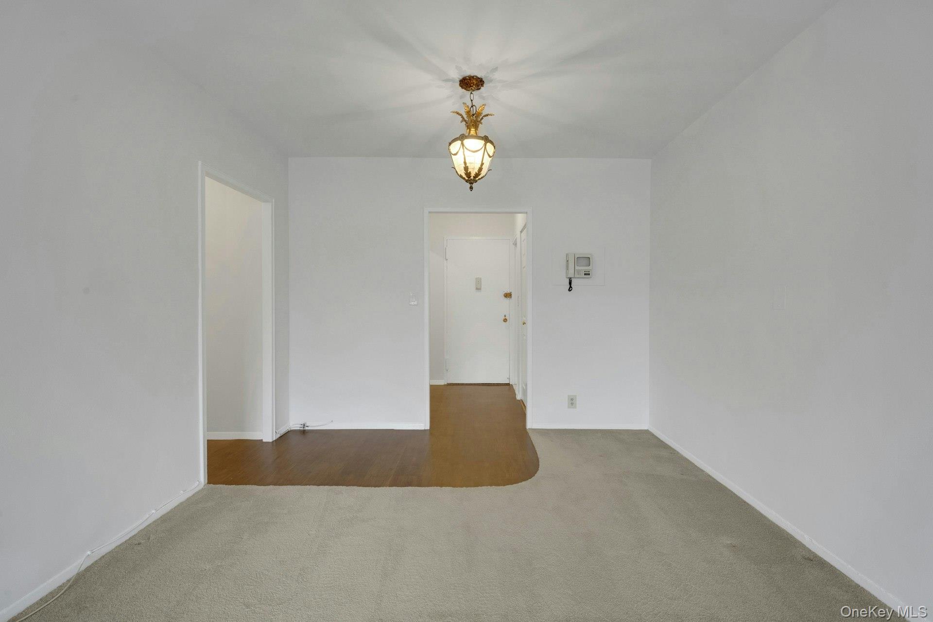 260 Garth Road, Unit 4E4 Scarsdale, NY 10583 - Photo 23 of 29 Carpeted empty room with baseboards