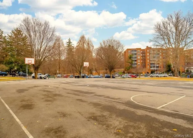 a city street with cars parked