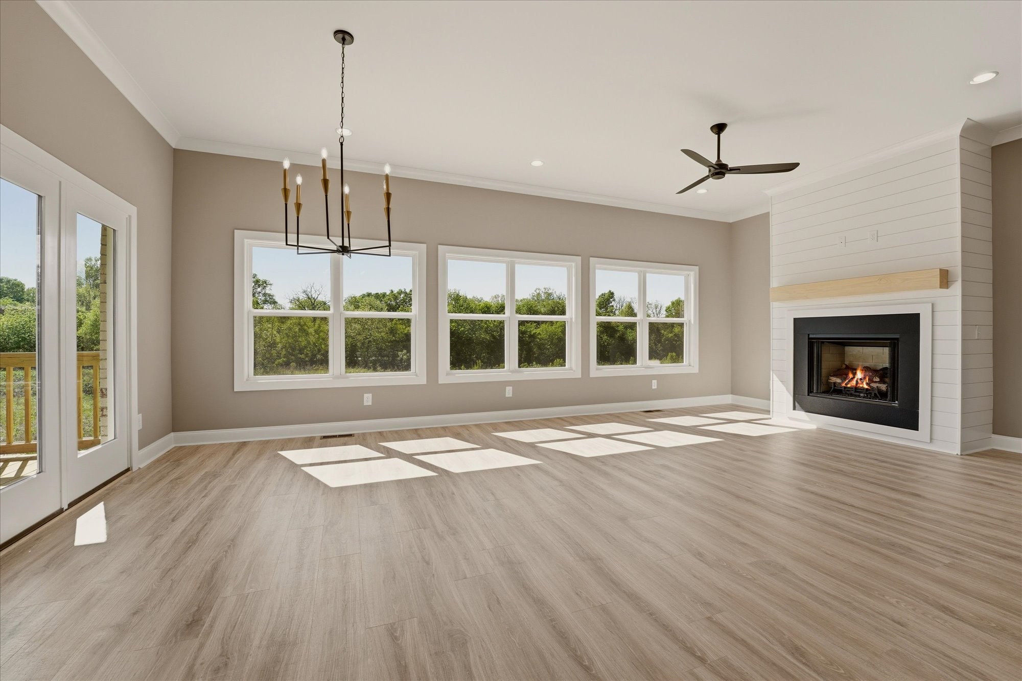 135 Stewarts Lndg Drive Mount Juliet, TN 37122 - Photo 12 of 44 a view of an empty room with a window and wooden floor