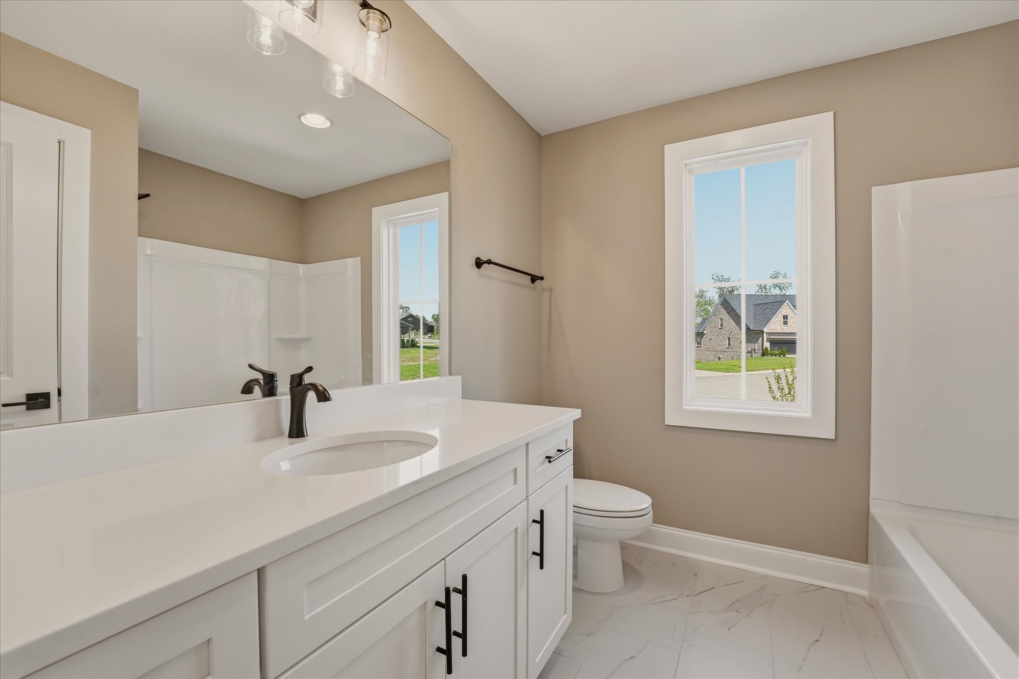 135 Stewarts Lndg Drive Mount Juliet, TN 37122 - Photo 28 of 44 a bathroom with a double vanity sink toilet and a mirror
