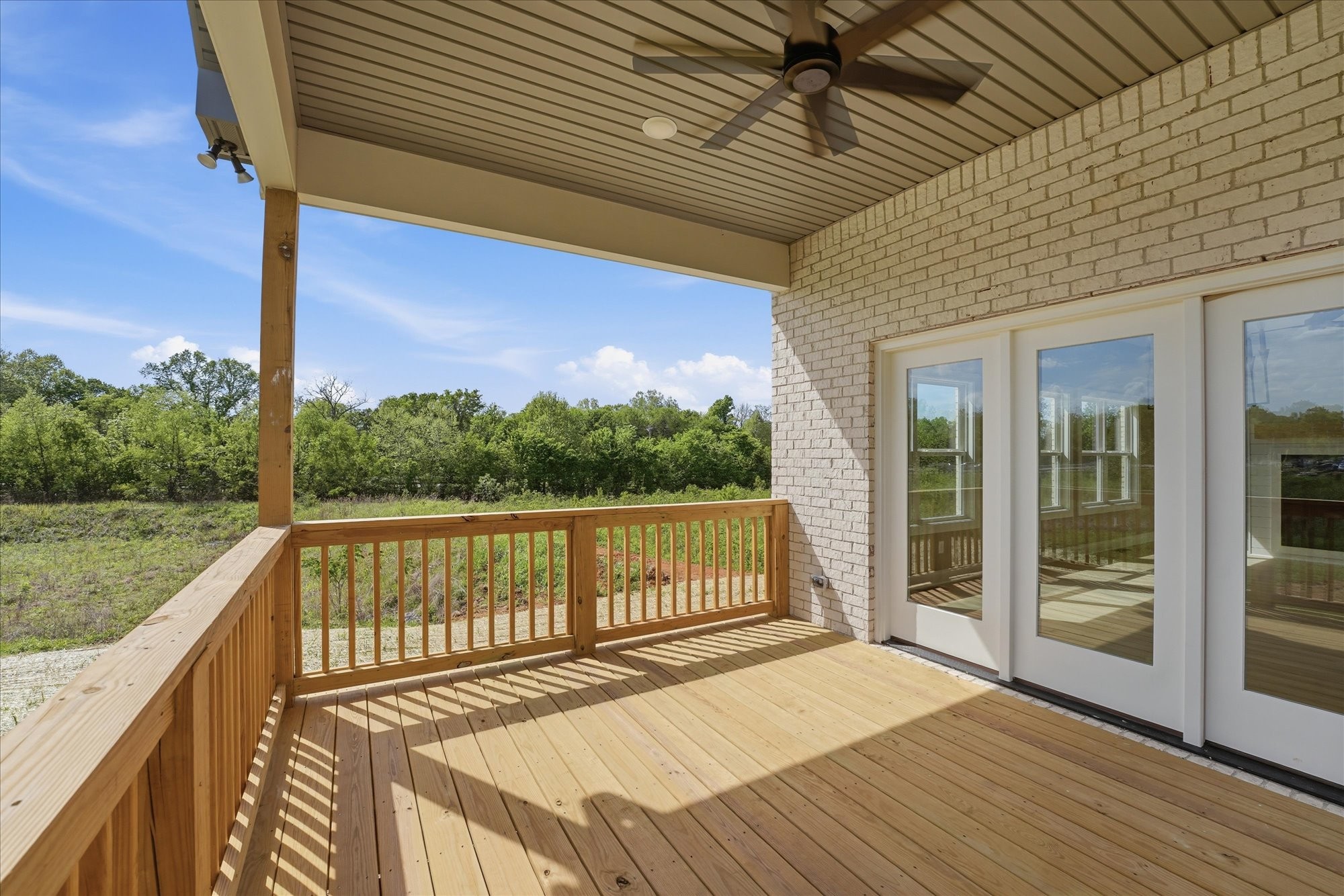 135 Stewarts Lndg Drive Mount Juliet, TN 37122 - Photo 39 of 44 a view of a balcony with wooden floor and iron stairs