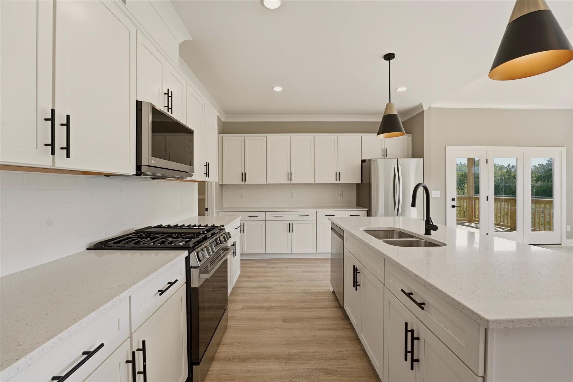 135 Stewarts Lndg Drive Mount Juliet, TN 37122 - Photo 6 of 44 a kitchen with stainless steel appliances granite countertop a sink and a stove