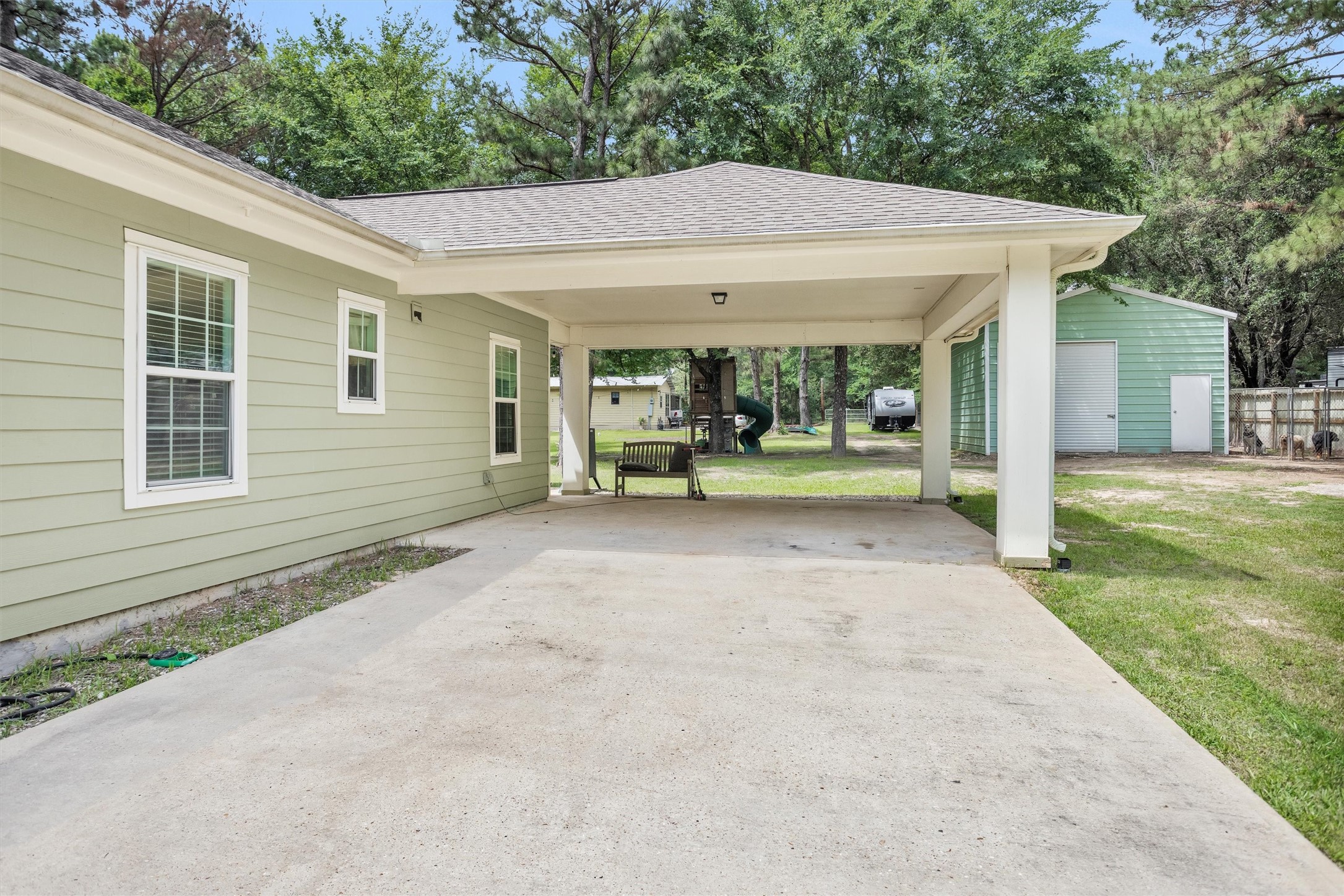 30806 Mellman Road Hempstead, TX 77445 - Photo 4 of 35 Double parking in your 20x20 carport and covered walkway to the back covered patio.