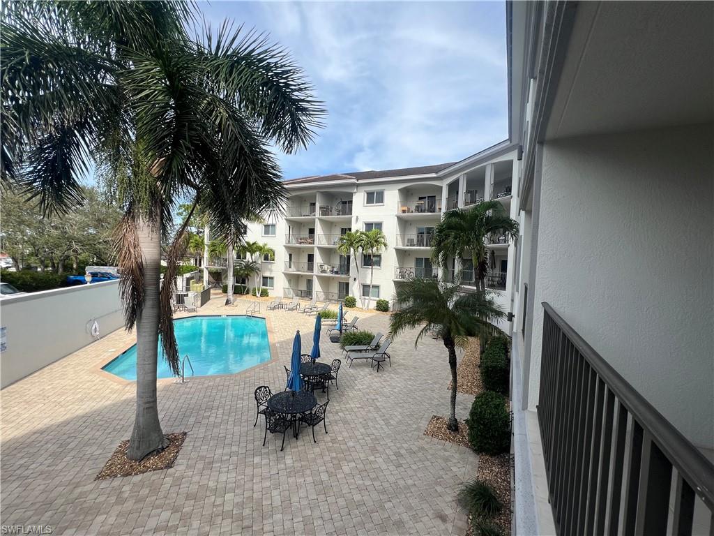 Community pool featuring a patio