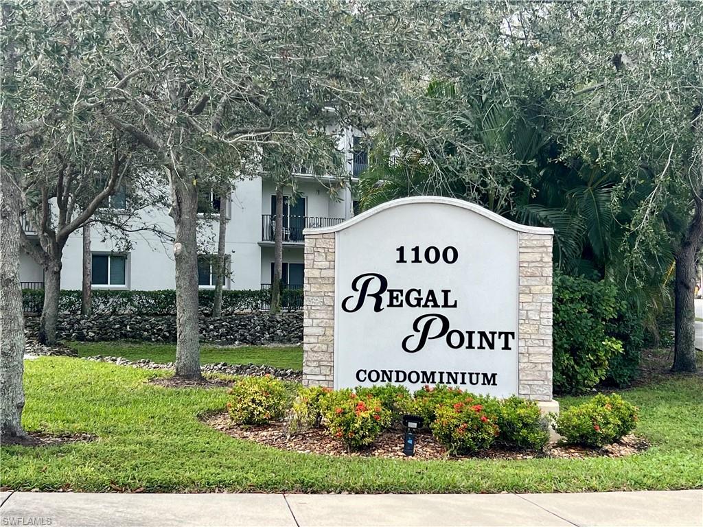 Community / neighborhood sign with a lawn