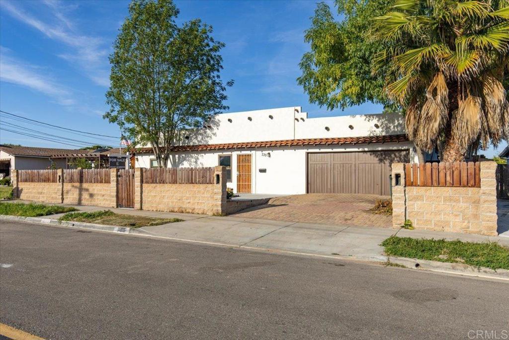 a view of a house with a yard and plant
