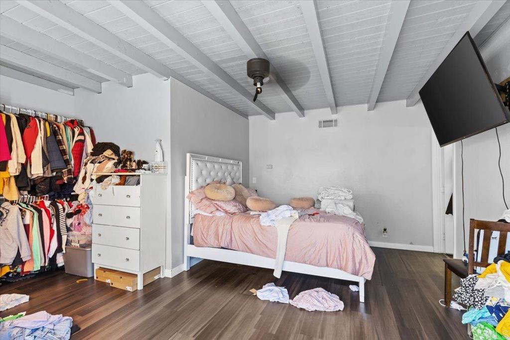 735 Osage Street Spring Valley, CA 91977 - Photo 19 of 25 a bedroom with a bed and a tv