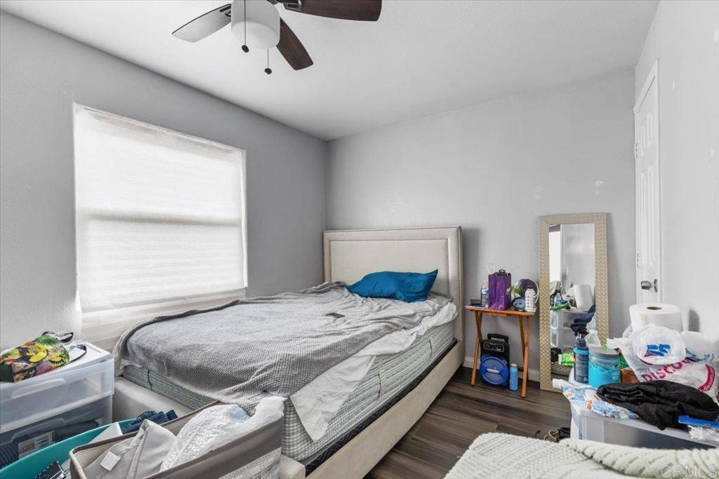735 Osage Street Spring Valley, CA 91977 - Photo 20 of 25 a bedroom with a bed and a window