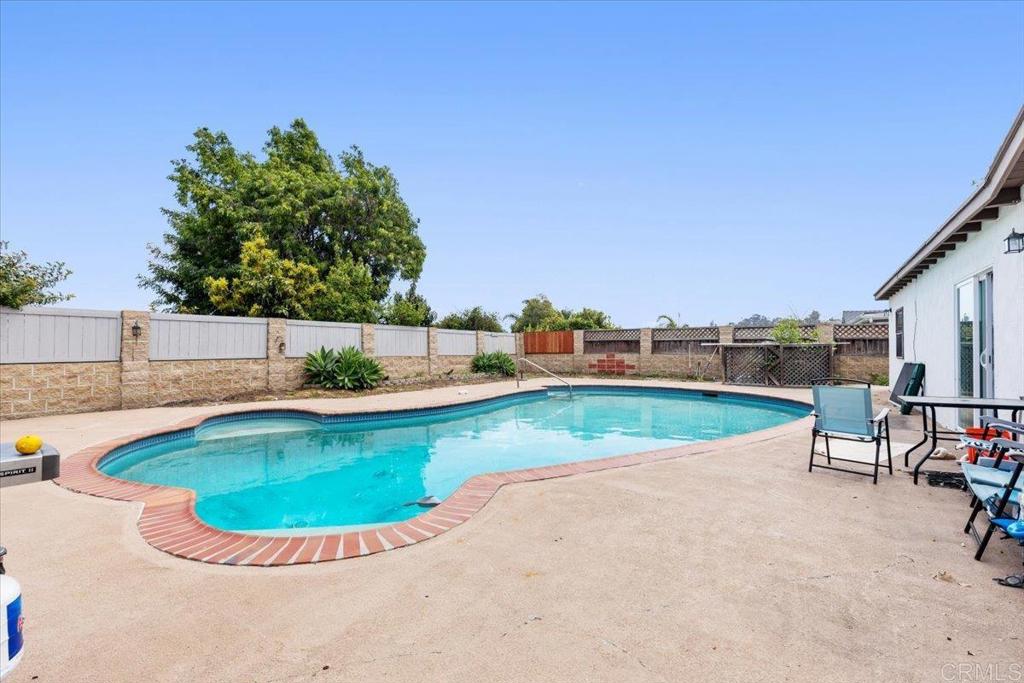 735 Osage Street Spring Valley, CA 91977 - Photo 21 of 25 a view of a swimming pool with a lounge chair