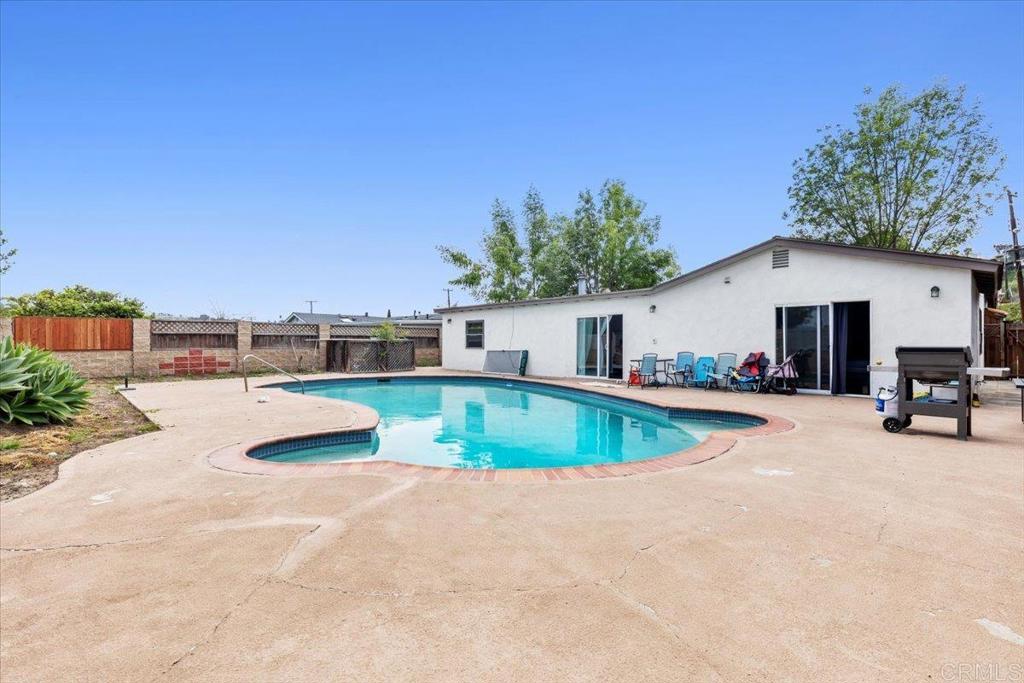 735 Osage Street Spring Valley, CA 91977 - Photo 22 of 25 a view of a swimming pool with chairs