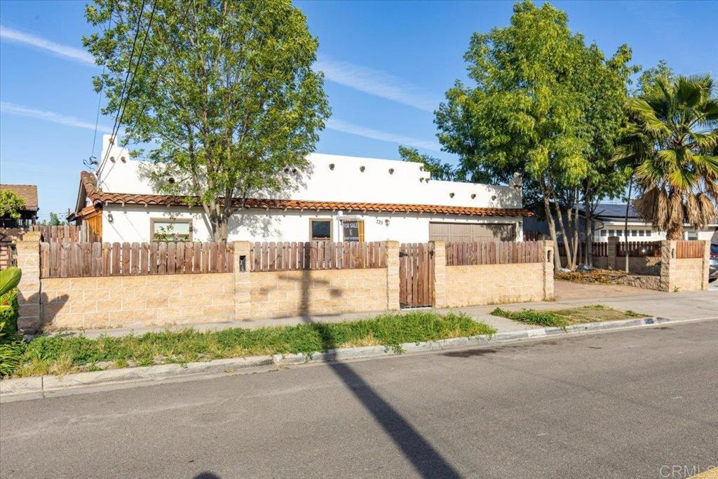 735 Osage Street Spring Valley, CA 91977 - Photo 25 of 25 a front view of a house with a yard and garage