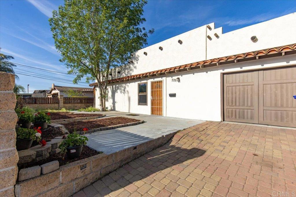 735 Osage Street Spring Valley, CA 91977 - Photo 3 of 25 a front view of a house with garden
