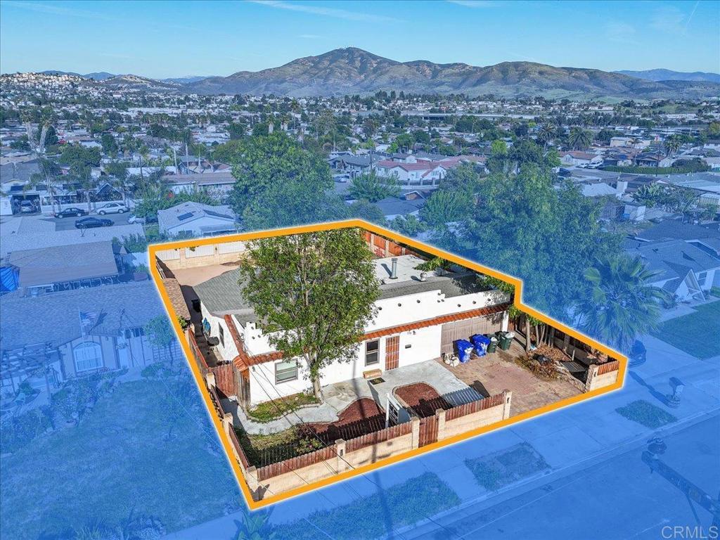 735 Osage Street Spring Valley, CA 91977 - Photo 7 of 25 an aerial view of a house roof deck and mountain view