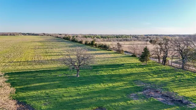 a view of a lake with a big yard
