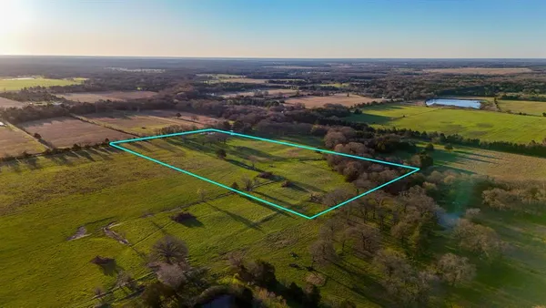 a view of a lake with a big yard