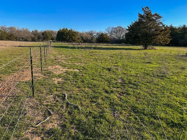 a view of a big yard with a house