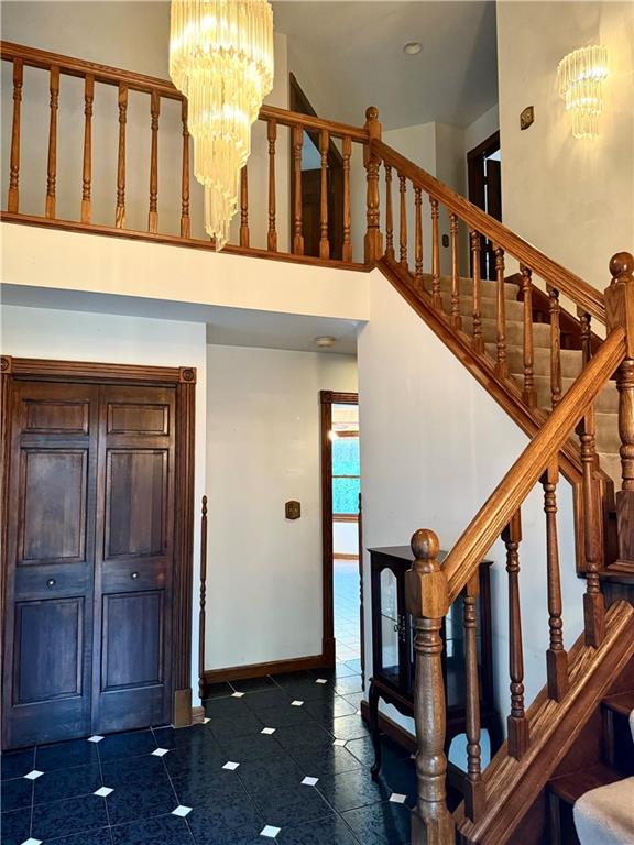 796 Hoover Road New Castle, PA 16101 - Photo 13 of 43 a view of staircase with lots of frames on wall