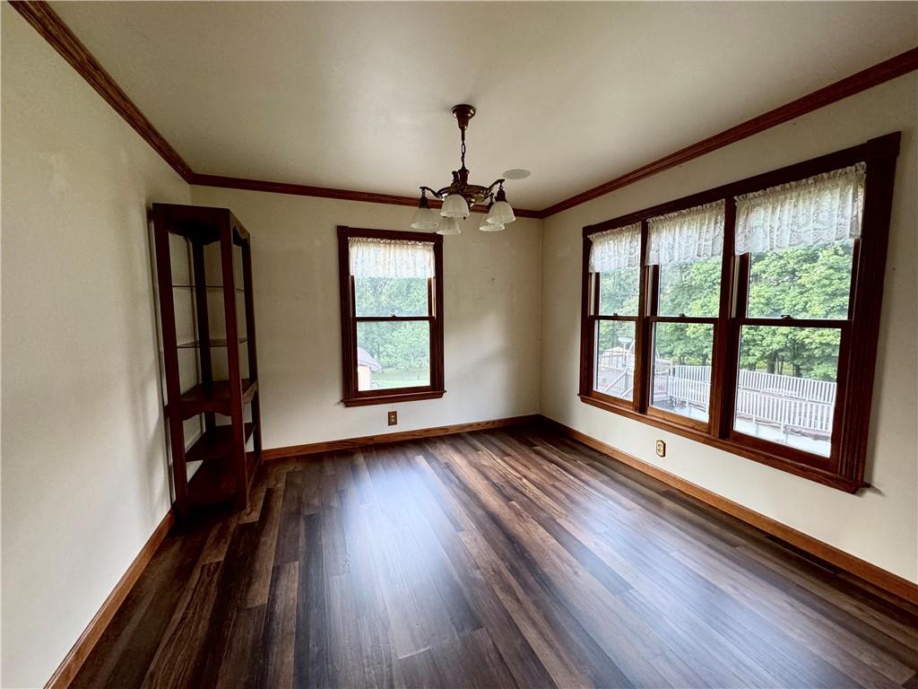 796 Hoover Road New Castle, PA 16101 - Photo 21 of 43 wooden floor in an empty room with a window