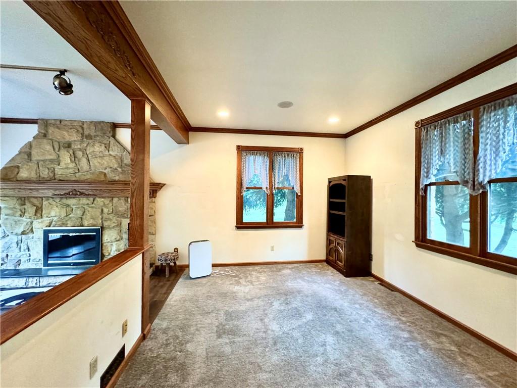796 Hoover Road New Castle, PA 16101 - Photo 24 of 43 a view of an empty room with a fireplace and a window
