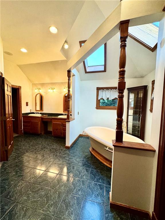 796 Hoover Road New Castle, PA 16101 - Photo 30 of 43 a spacious bathroom with double vanity and a bathtub