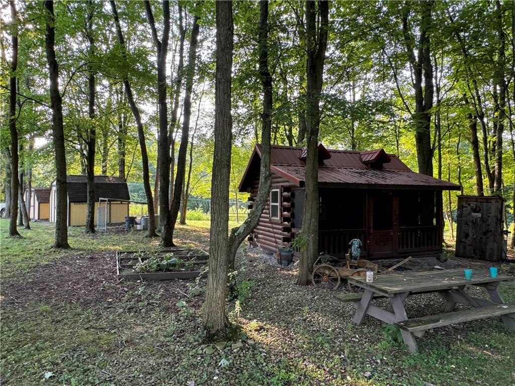 796 Hoover Road New Castle, PA 16101 - Photo 40 of 43 a view of a house with backyard and trees