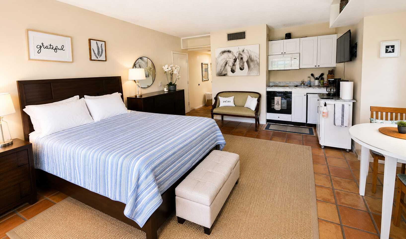 13334 Polo Club Road, Unit 216 Wellington, FL 33414 - Photo 2 of 9 a spacious bedroom with a bed and dresser