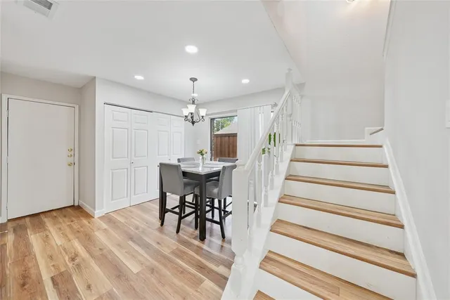 a view of dining room and hall with wooden floor