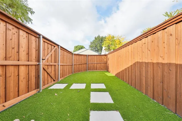 a view of backyard with cabin
