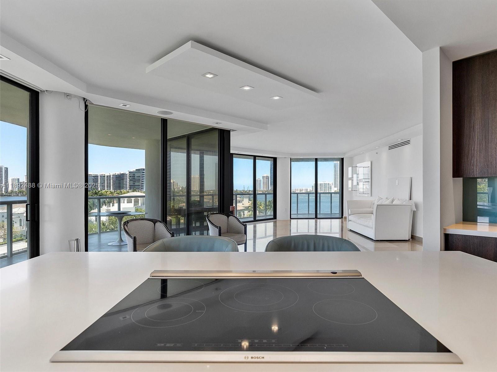 4000 Island Boulevard, Unit 606 Aventura, FL 33160 - Photo 15 of 36 a lobby with furniture and large windows