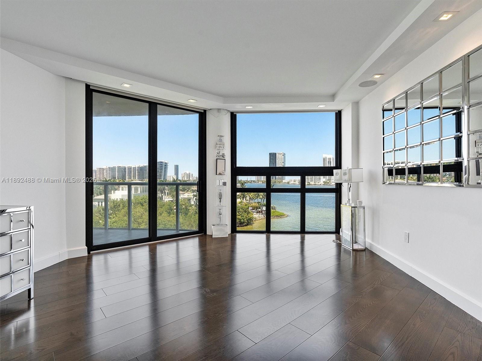 4000 Island Boulevard, Unit 606 Aventura, FL 33160 - Photo 24 of 36 a view of an entryway with wooden floor