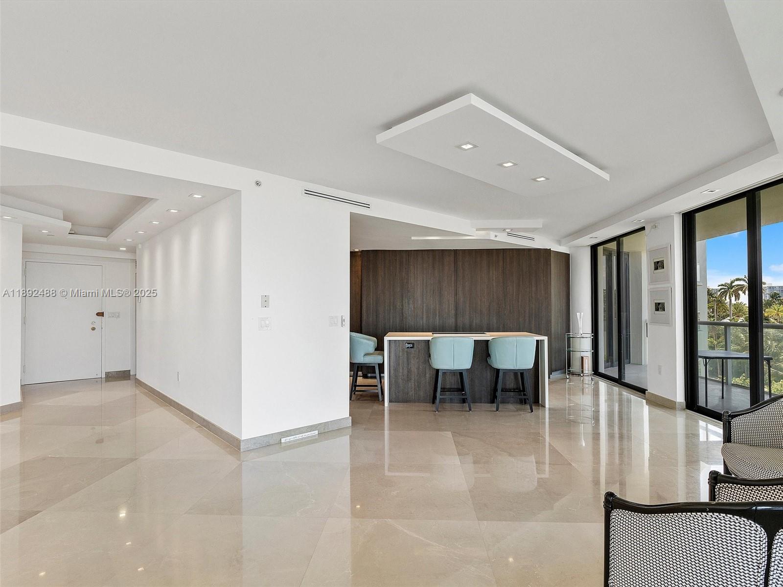 4000 Island Boulevard, Unit 606 Aventura, FL 33160 - Photo 9 of 36 a view of kitchen with furniture and window