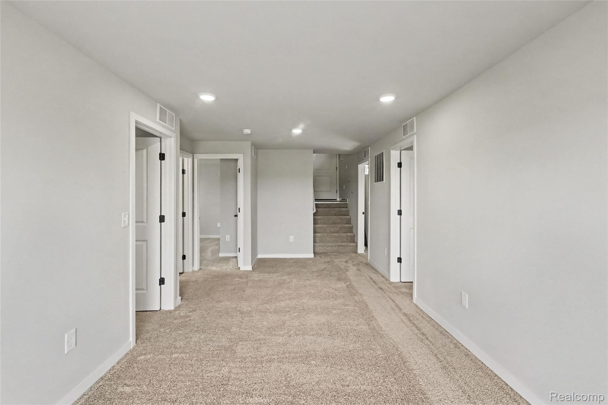 5528 Lahring Road Linden, MI 48451 - Photo 13 of 39 The lower level rec room offers direct access to the rear yard. 3 bedrooms, full bath and utility room round out the lower level.