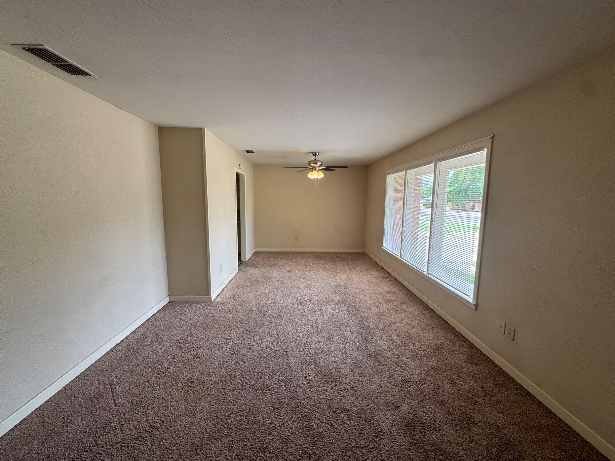 3605 40th Street Lubbock, TX 79413 - Photo 2 of 11 a view of an empty room with a window