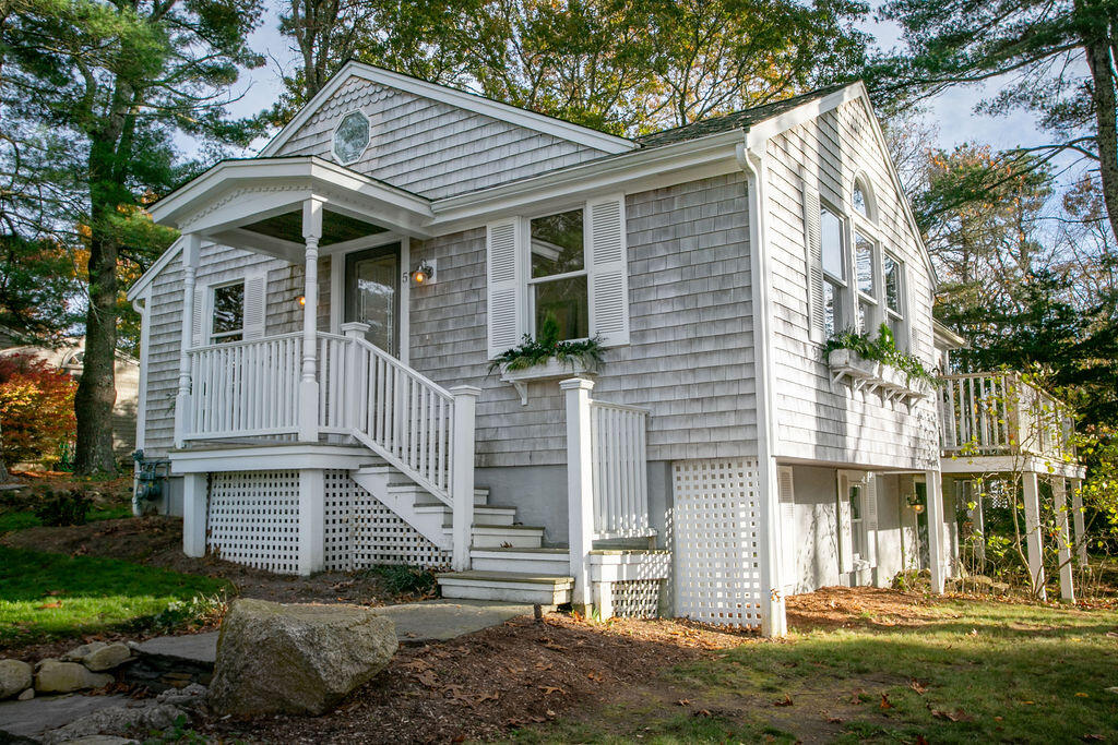 5 Scraggy Neck Rd Extension Bourne, MA 02534 - Photo 1 of 37 a view of a house with a yard