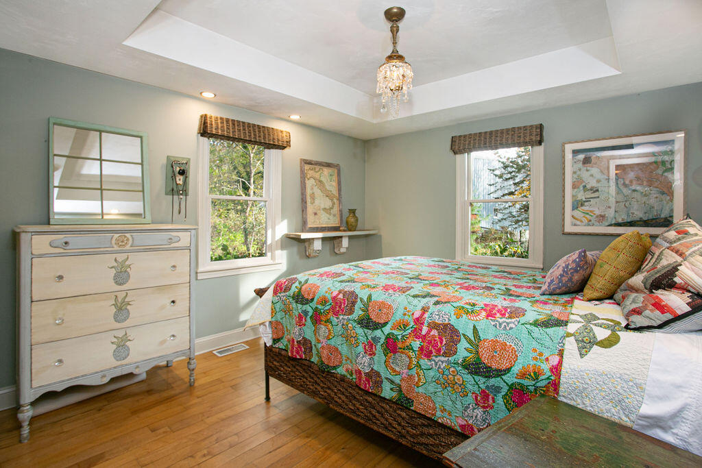 5 Scraggy Neck Rd Extension Bourne, MA 02534 - Photo 13 of 37 a bedroom with a bed and wooden floor