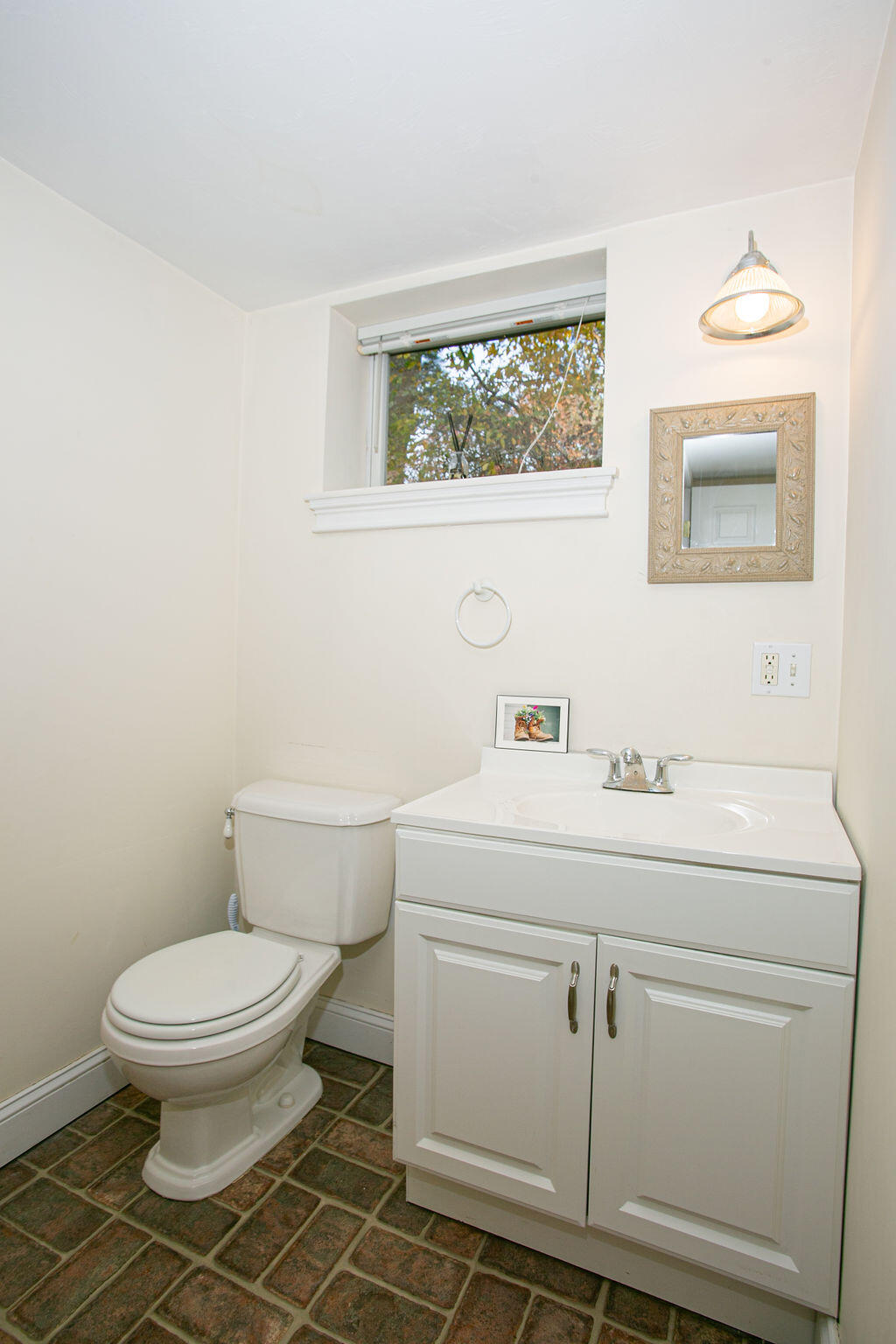 5 Scraggy Neck Rd Extension Bourne, MA 02534 - Photo 18 of 37 a bathroom with a toilet sink and mirror