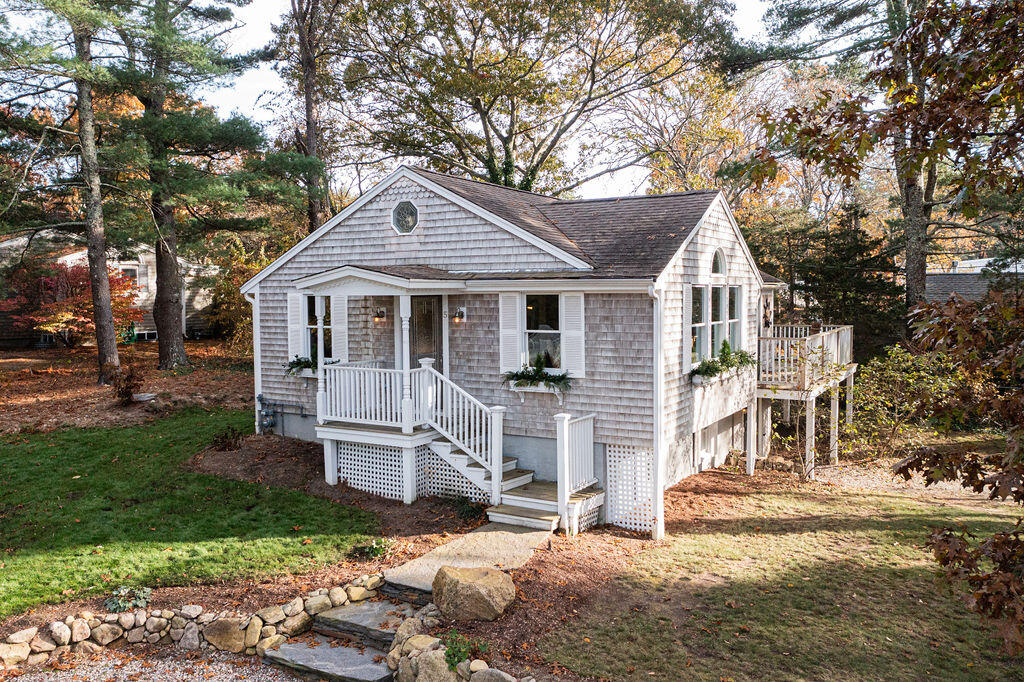 5 Scraggy Neck Rd Extension Bourne, MA 02534 - Photo 34 of 37 a front view of a house with a yard