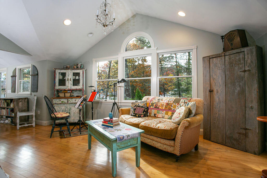 5 Scraggy Neck Rd Extension Bourne, MA 02534 - Photo 5 of 37 a living room with furniture a dining table and a large window