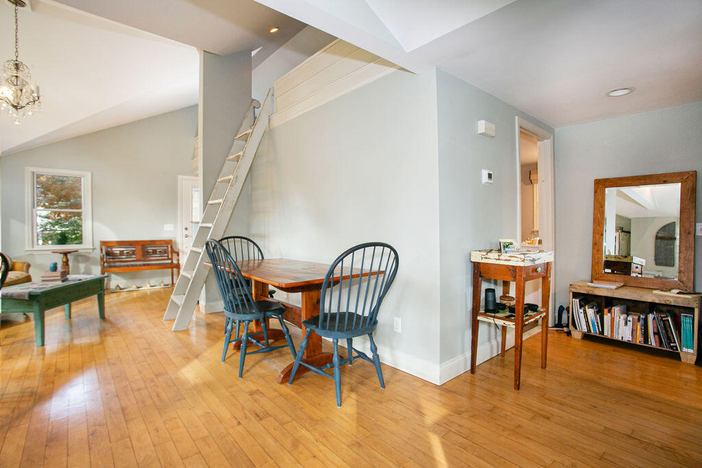 5 Scraggy Neck Rd Extension Bourne, MA 02534 - Photo 7 of 37 a view of a dining room with furniture and wooden floor