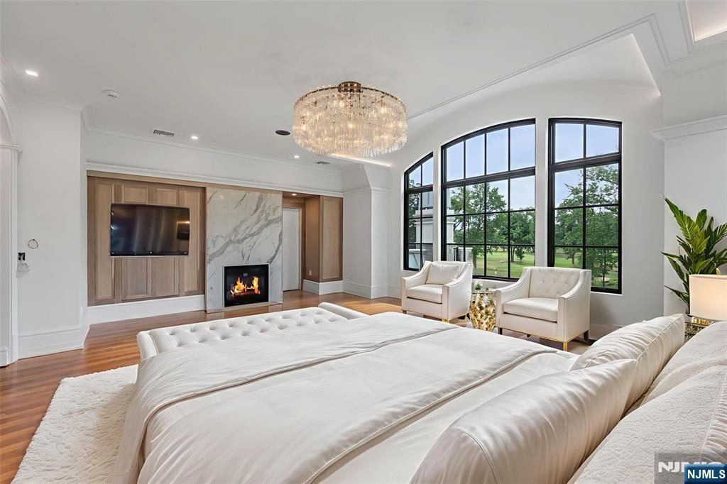 19 Rio Vista Drive Alpine, NJ 07620 - Photo 26 of 49 a spacious bedroom with a large bed and a large window