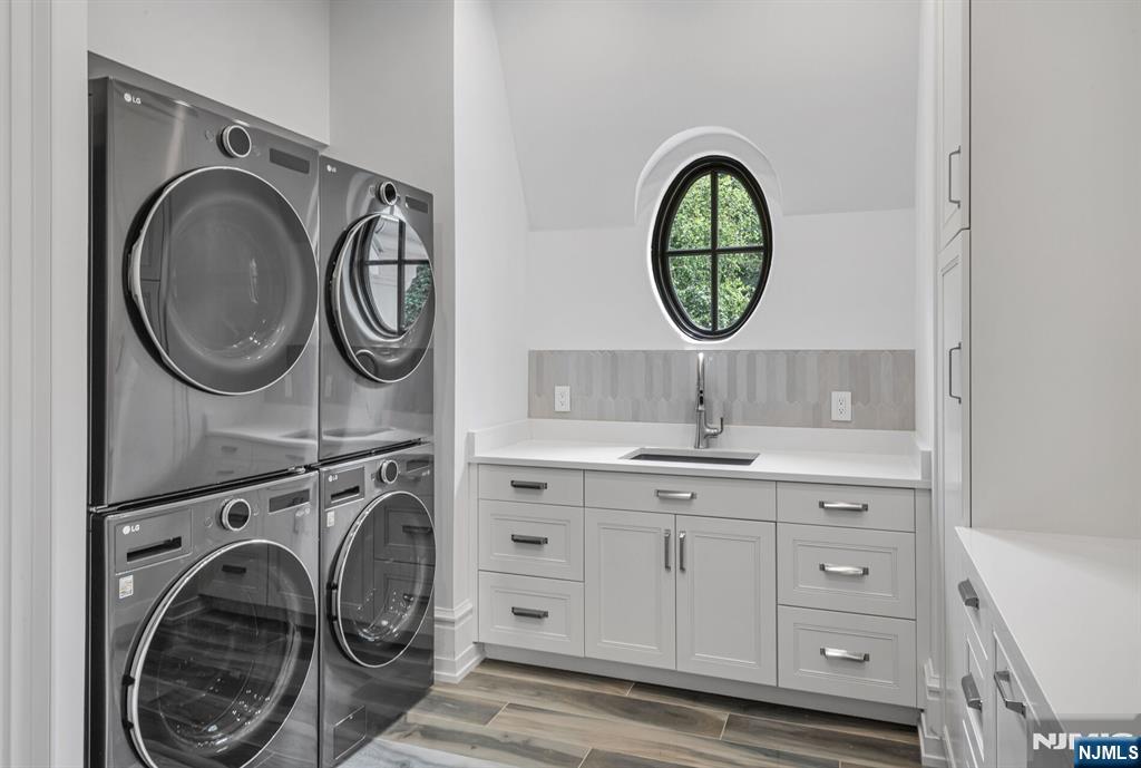 19 Rio Vista Drive Alpine, NJ 07620 - Photo 33 of 49 a bathroom with a granite countertop sink and a mirror