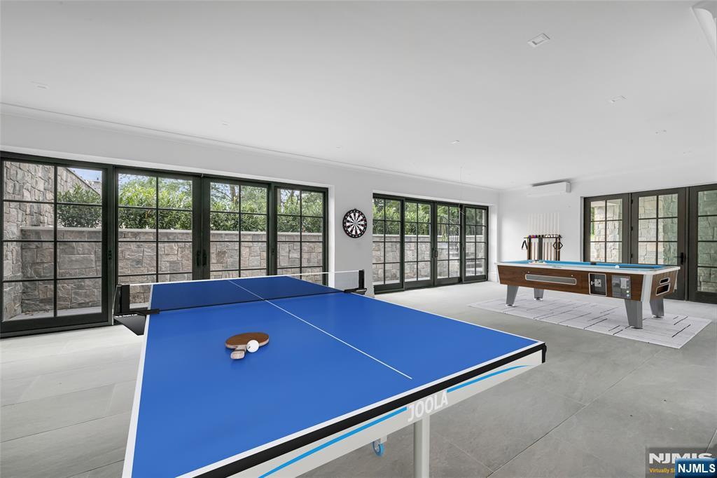 19 Rio Vista Drive Alpine, NJ 07620 - Photo 40 of 49 a room with pool table and windows