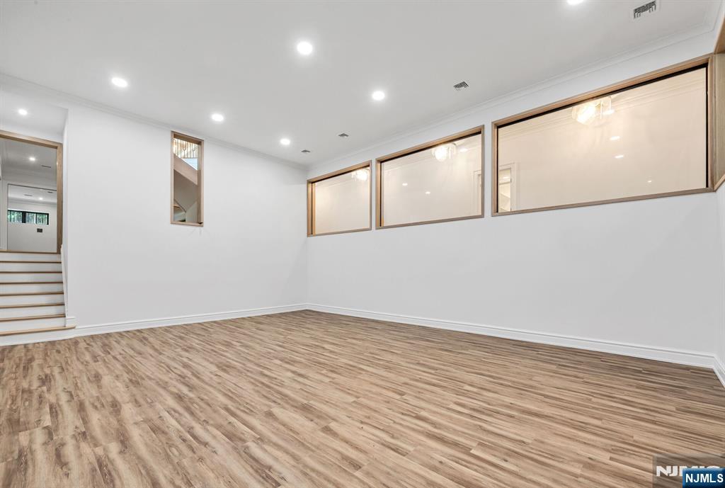 19 Rio Vista Drive Alpine, NJ 07620 - Photo 42 of 49 a view of empty room with wooden floor