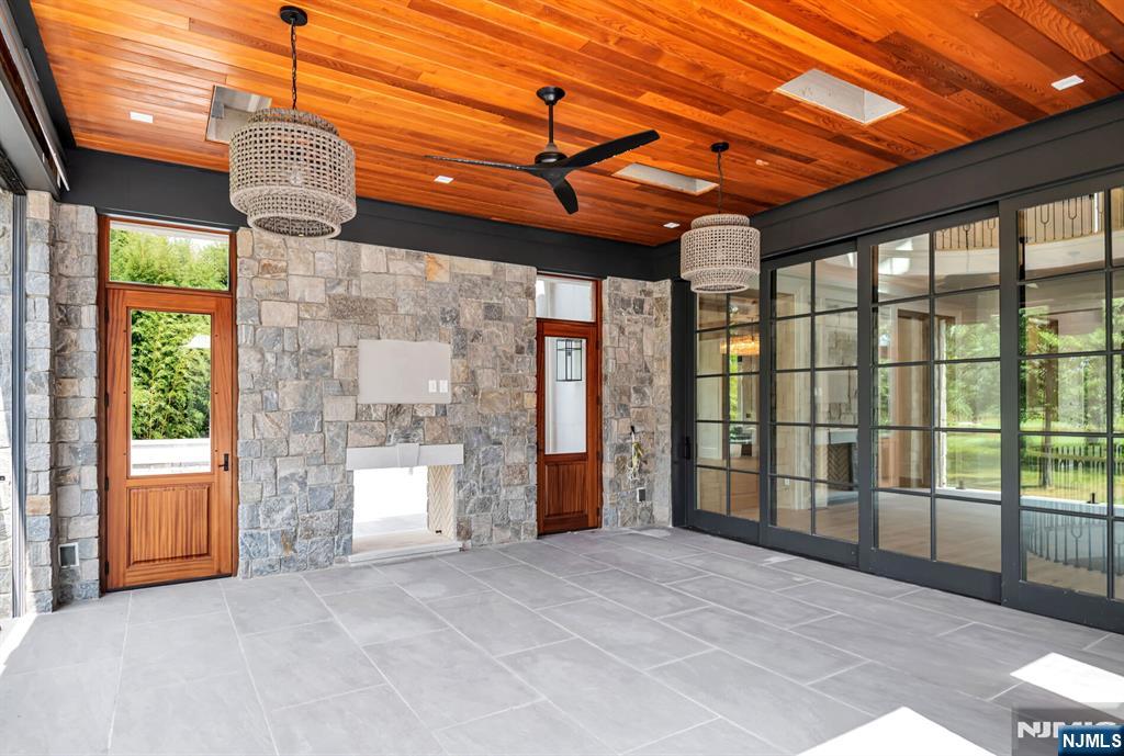 19 Rio Vista Drive Alpine, NJ 07620 - Photo 44 of 49 a view of a room with large windows and a chandelier