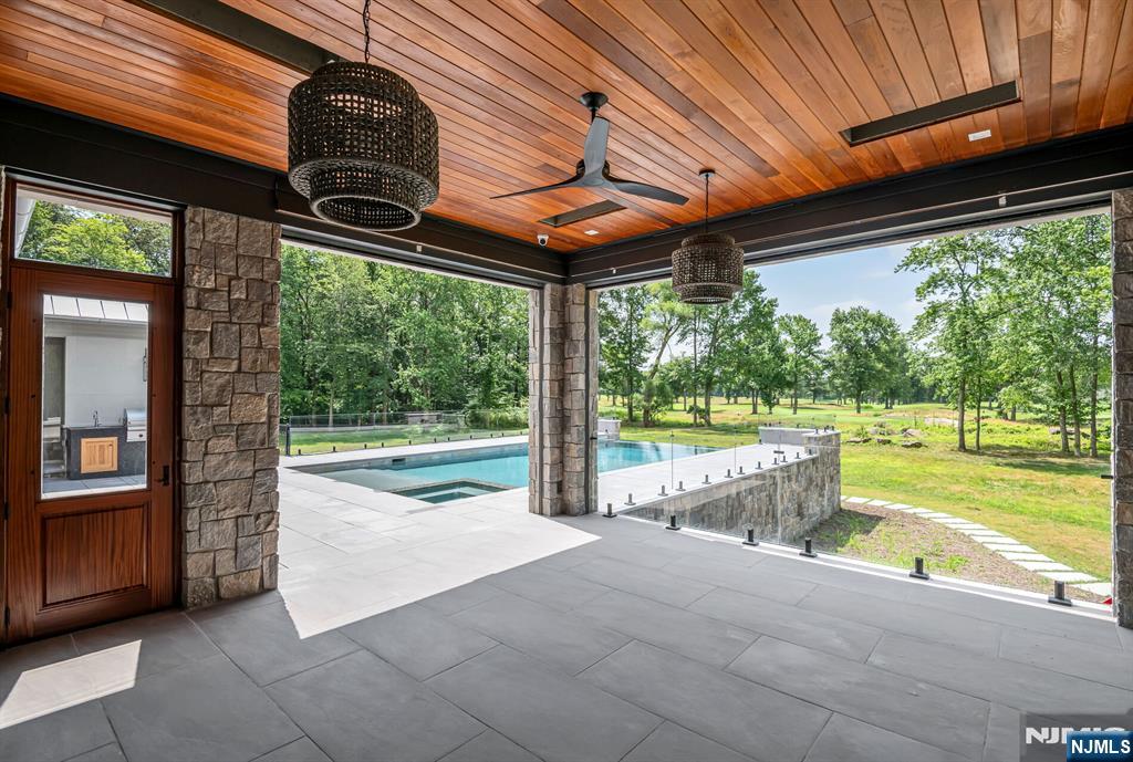 19 Rio Vista Drive Alpine, NJ 07620 - Photo 45 of 49 a view of a backyard with a swimming pool