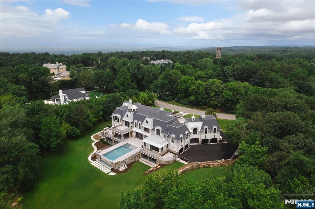 19 Rio Vista Drive Alpine, NJ 07620 - Photo 49 of 49 an aerial view of a house with garden space and street view