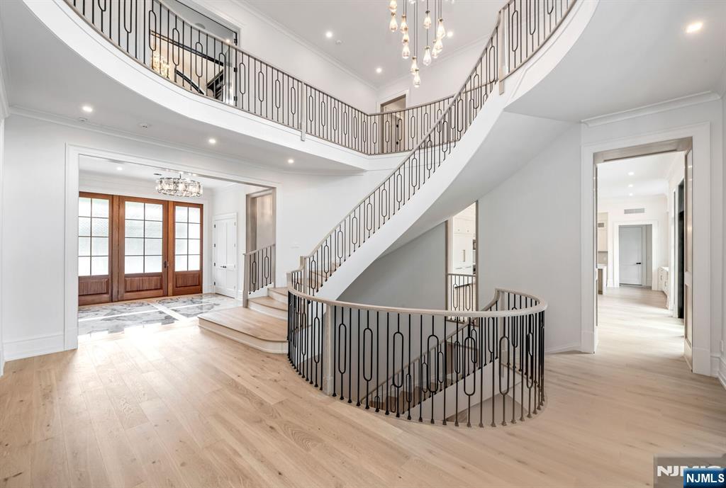 19 Rio Vista Drive Alpine, NJ 07620 - Photo 7 of 49 a view of an entryway wooden floor and staircase