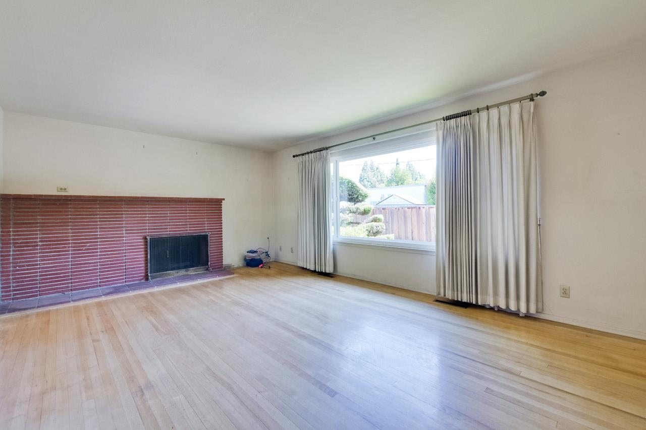 2738 Cramer Circle San Jose, CA 95111 - Photo 26 of 63 a view of empty room with wooden floor and fireplace